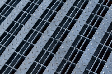 Drainage grating for road gutters.