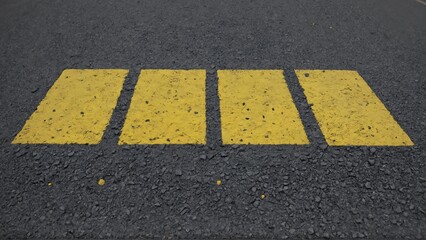 Road marking with bright yellow paint