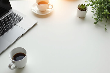 A steaming cup of coffee and a laptop rest on a brown table, a classic morning break
