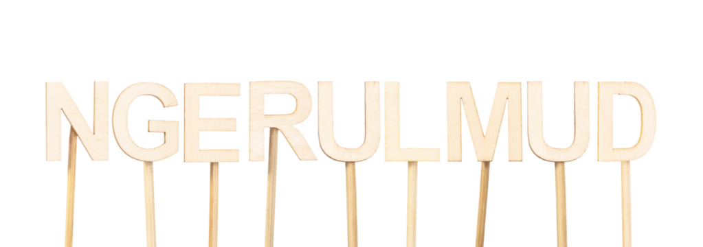 Ngerulmud, capital of Palau, presented with wooden letters on white surface