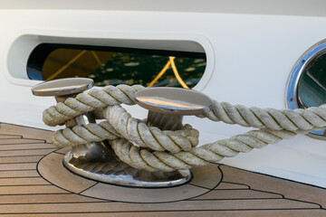 Bollard (cleat) with mooring line on superyacht. Mooring gear on yacht. Superyacht equipment. 