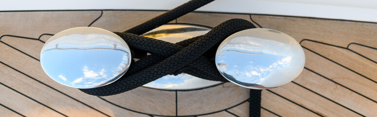 Bollard (cleat) with mooring line on superyacht. Mooring gear on yacht. Superyacht equipment. 