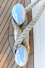 Bollard (cleat) with mooring line on superyacht. Mooring gear on yacht. Superyacht equipment. Top...