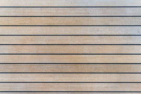 Teak wood deck texture background. Wooden deck on super yacht. Yachting concept.