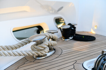 Bollard (cleat) with mooring line on superyacht. Mooring gear on yacht. Superyacht equipment. 
