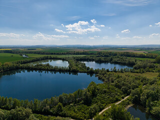 Experience the Serene Aerial View of Lush Green Lakes Embraced by Vibrant Landscape Koldinger Seen...