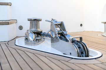 Anchor winch on superyacht. Anchoring and mooring gear on yacht. Superyacht equipment.