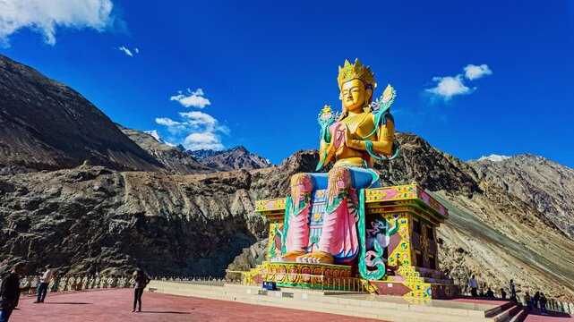 Ladakh,India-May,23,2025: Timelapse blue sky over A Diskit Monastery. the golden big Buddha Diskit Gompa is the oldest and largest Buddhist monastery (gompa) in the Nubra Valley of Ladakh, India.
