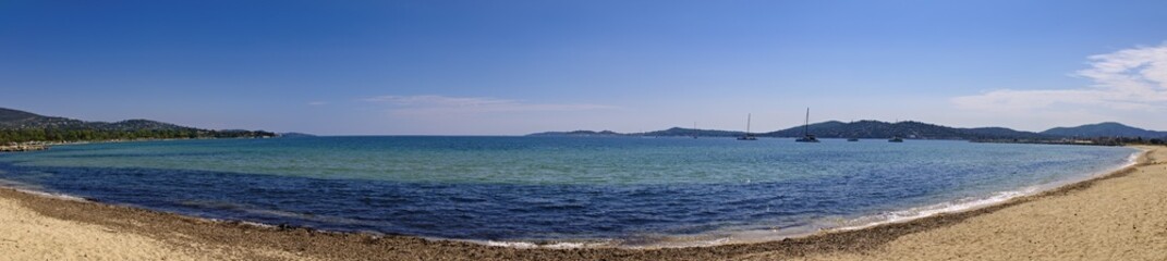 Panoramic view over the bay of Saint Tropez from Port Grimaud with beach, sea and boats