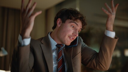 Businessman complaining cellphone call reviewing documents at evening closeup