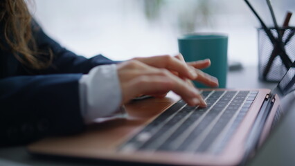 Lady fingers typing keyboard laptop making online research writing email closeup