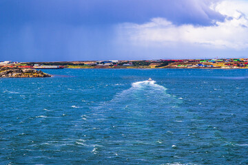 A boat traveles to the city of Stanley pier in the Falkland Islands, UK.
