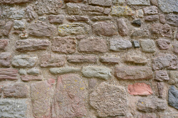 Old stone wall texture, rough masonry background of natural rocks in ancient architecture