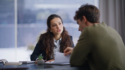 Professional consultant talking client discussing at panoramic office closeup