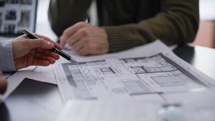 Engineer hand pointing plan calculating budget buro closeup. Architect customer