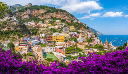 Scenic view of the colorful cliffside town of Positano on the Amalfi Coast, Italy, with traditional Mediterranean architecture and the Tyrrhenian Sea.