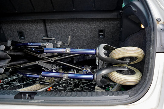 Wheelchair folded in the trunk of a car