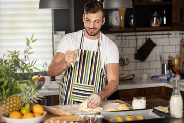 Happy baker kneading dough
