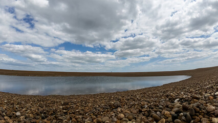 The pool in the beach at Shingle Street in Suffolk, UK