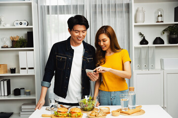 Chef influencers reading comment on phone for answering time on social media cooking show channel...