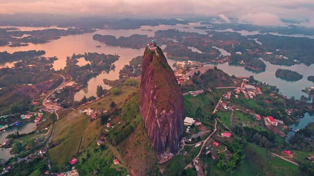 Aerial view of La Piedra del Pe&ntilde;ol monolith and lake at sunset &ndash; Guatap&eacute;, Medell&iacute;n, Colombia
