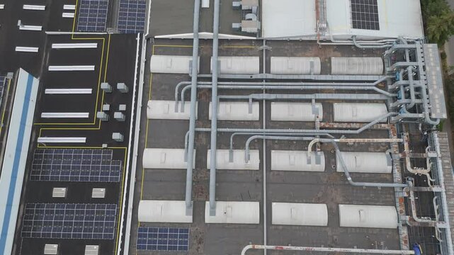 Roof of a modern furniture factory with solar panels from drone. Trnava, Slovakia