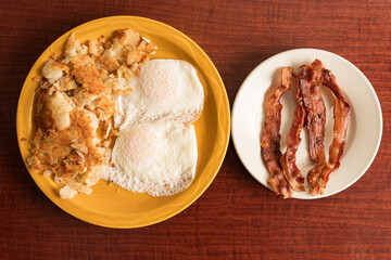 Two eggs, hash browns and bacon