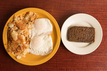 Two eggs, hash browns and scrapple
