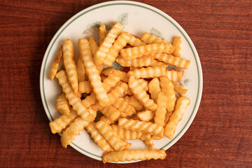 Plate of crinkle cut fries