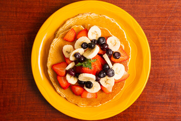Pancakes topped with fresh fruit