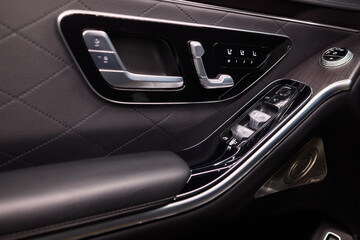 Naklejka premium Modern Car Door Control Panel with Window Switches for convenience and functionality