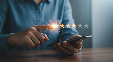 Reaching for five-star success, a person's hand interacts with glowing review stars on a smartphone, a digital moment of triumph.