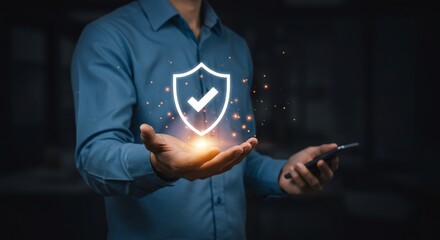 Man's Hand Holding Glowing Shield Symbolizing Data Protection and Security