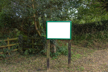 A rural community notice board with blank signage space.