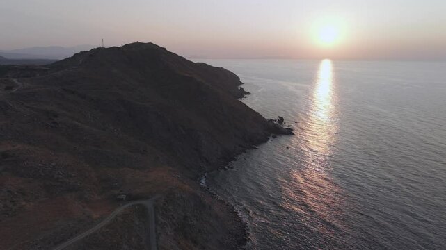 A drone flight across the rough and dry coast line at the north of Crete island close to the city of Heraklion 