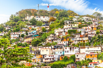 Shantytown favelas on the hill in Fort De France, Martinique. Fort-de-France is a commune and the capital city of Martinique, a French department located in the Caribbean.