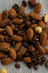 Old spoiled almonds and hazelnuts on top close up