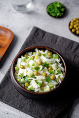 Cabbage cucumber green peas mayonnaise salad in a bowl