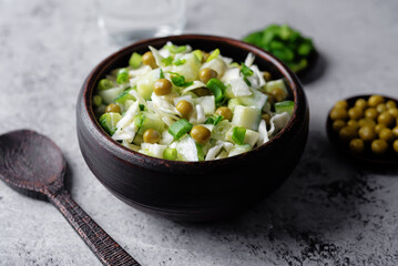 Cabbage cucumber green peas mayonnaise salad in a bowl