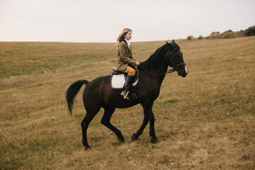 Woman Riding a Horse Across a Scenic Countryside During Autumn