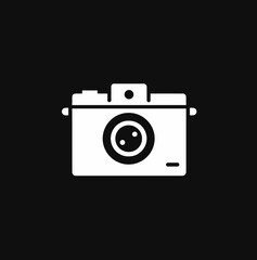 Camera icon silhouette on black background for photography and media design concept