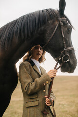 Elegant Woman with a Horse in an Outdoor Countryside Setting