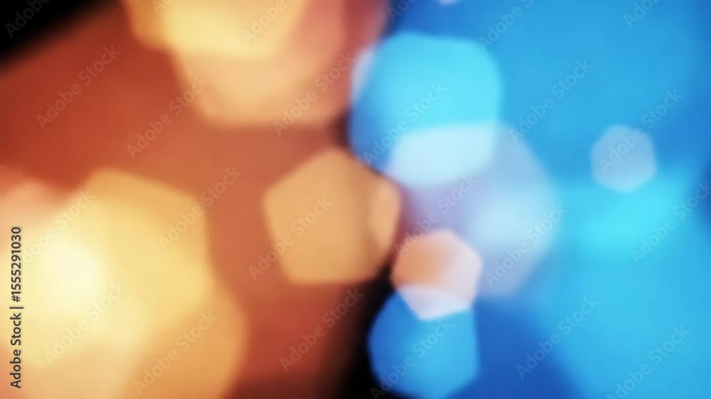 Poster abstract blue and orange bokeh lights moving and fading, with hexagonal blurry shapes for background
