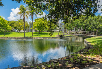 A view of the footbridge over the lake at Graham Park in Miami Lakes, Florida