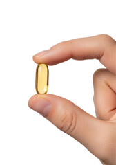 Hand holding omega-3 fish oil capsule isolated on transparent background, supplement close-up