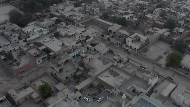 expansive farmland, showcasing vast green fields with scattered patches of agricultural plots