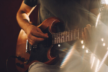 Fototapeta premium Musician playing electric guitar in recording studio