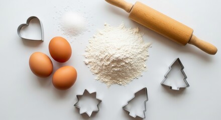 Holiday baking essentials with eggs, flour, and festive cookie cutters for creative kitchen fun