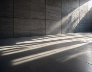 Parallel sunlight beams casting distinct patterns on a gray concrete wall and floor