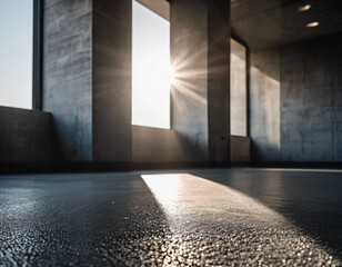 Parallel sunlight beams casting distinct patterns on a gray concrete wall and floor